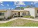 Charming single-story home featuring a well-maintained front lawn and inviting curb appeal at 8130 Braddock Cir # 3, Port Richey, FL 34668
