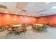 Spacious game room features several round tables with chairs for playing cards or board games at 8130 Braddock Cir # 3, Port Richey, FL 34668