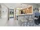An open kitchen with breakfast bar and modern appliances, seamlessly connected to the entryway at 8130 Braddock Cir # 3, Port Richey, FL 34668