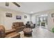 Bright living room with comfortable seating, neutral walls, and an inviting atmosphere at 8130 Braddock Cir # 3, Port Richey, FL 34668