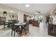 Spacious and open living area adjacent to the dining area for easy flow and socializing at 8130 Braddock Cir # 3, Port Richey, FL 34668