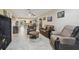 Spacious living room with tile floors, comfortable leather seating, and stylish decor at 8130 Braddock Cir # 3, Port Richey, FL 34668