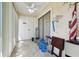 Enclosed patio featuring tiled floors, ceiling fan and access to the backyard at 8130 Braddock Cir # 3, Port Richey, FL 34668