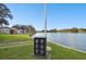 Waterfront community featuring a monument for the United States Armed Forces alongside the lake at 8130 Braddock Cir # 3, Port Richey, FL 34668