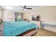 Bedroom features include a ceiling fan, neutral walls, and a comfortable bed at 864 Pinewood W Ter, Palm Harbor, FL 34683