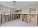Another bedroom with natural light, featuring tile floors and exposed walls ready for a remodel at 9101 Oak Ne St, St Petersburg, FL 33702