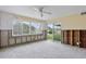 Spacious living room featuring a large window with canal views and exposed wall studs at 9101 Oak Ne St, St Petersburg, FL 33702