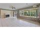 Living room with tile flooring and canal view windows; interior wall shows visible framing at 9101 Oak Ne St, St Petersburg, FL 33702
