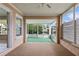 Enclosed porch with view to the canal and a partially visible interior wall at 9101 Oak Ne St, St Petersburg, FL 33702