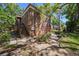 Exterior shot of a beautiful building in a green space with lush trees at 10453 Carrollbrook Cir # 122, Tampa, FL 33618