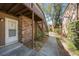 Exterior entry featuring brick facade, covered stairs and concrete walkway at 10453 Carrollbrook Cir # 122, Tampa, FL 33618