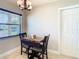 Cozy dining area with table and chairs, adjacent to a bright window at 1348 Chesterfield Dr, Clearwater, FL 33756
