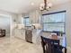 Updated kitchen featuring a dining table, stainless steel appliances, and granite countertops at 1348 Chesterfield Dr, Clearwater, FL 33756