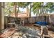 Backyard featuring a wood fence, concrete pavers and a sitting area, providing a private outdoor space at 1888 Springbush Ln, Clearwater, FL 33763