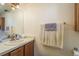 Bathroom featuring a vanity with a sink and a towel rack with a neatly folded towel at 1888 Springbush Ln, Clearwater, FL 33763
