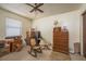 Bedroom filled with household items including dressers, chairs and boxes at 1888 Springbush Ln, Clearwater, FL 33763