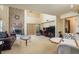 Spacious living room with a brick fireplace, tall ceilings, and sliding glass doors at 1888 Springbush Ln, Clearwater, FL 33763