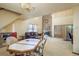 Open living room with high ceilings, chandelier, brick fireplace, and comfortable seating at 1888 Springbush Ln, Clearwater, FL 33763