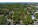 Overhead view featuring the home and its location in a verdant, residential area, ocean in the background at 203 S Coolidge Ave, Tampa, FL 33609