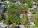 A secluded homesite with mature trees offering privacy in a vibrant neighborhood at 203 S Coolidge Ave, Tampa, FL 33609
