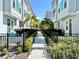 Townhomes with lush landscaping and a walking path in the backyard at 208 S Tampania Ave # 4, Tampa, FL 33609
