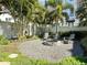 A lovely fire pit area surrounded by Adirondack chairs and lush greenery at 208 S Tampania Ave # 4, Tampa, FL 33609