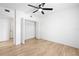 Bedroom featuring an open closet, overhead fan, and hardwood floors at 2224 E 10Th Ave, Tampa, FL 33605