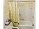 Bathroom with a bathtub and decorative shower curtain at 2331 Finlandia Ln # 43, Clearwater, FL 33763
