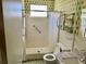 Bathroom features green patterned wallpaper, a walk-in shower, and sink at 2331 Finlandia Ln # 43, Clearwater, FL 33763