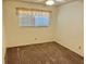This bedroom features neutral walls, carpeted floors, and a window at 2331 Finlandia Ln # 43, Clearwater, FL 33763