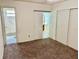 Bedroom with carpeting, closet, and access to a bathroom at 2331 Finlandia Ln # 43, Clearwater, FL 33763