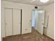 Bedroom with carpeting, closets, and neutral walls at 2331 Finlandia Ln # 43, Clearwater, FL 33763