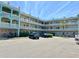 Well-maintained building featuring multiple stories with charming balcony railings and ample parking space at 2331 Finlandia Ln # 43, Clearwater, FL 33763