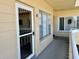 Condo exterior with unit number, storm door, and windows providing ample natural light at 2331 Finlandia Ln # 43, Clearwater, FL 33763