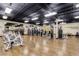 Spacious fitness center with an array of weight machines and cardio equipment on wood floors at 2331 Finlandia Ln # 43, Clearwater, FL 33763