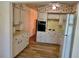 Efficient kitchen features white cabinets and appliances at 2331 Finlandia Ln # 43, Clearwater, FL 33763