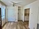 Living room boasts wood flooring, ceiling fan, and ample natural light at 2331 Finlandia Ln # 43, Clearwater, FL 33763