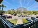 Community parking area with various vehicles parked under a clear blue sky at 2331 Finlandia Ln # 43, Clearwater, FL 33763