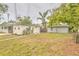 Backyard view showcasing the home and outdoor storage shed at 2412 53Rd S St, Gulfport, FL 33707