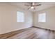 Bedroom features wood-look flooring, ceiling fan, and lots of natural light from the windows at 2412 53Rd S St, Gulfport, FL 33707