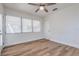 Bright bedroom with wood-look flooring, a ceiling fan, and large windows for natural light at 2412 53Rd S St, Gulfport, FL 33707
