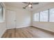 Bedroom featuring light wood floors, a modern ceiling fan fixture and bright natural light at 2412 53Rd S St, Gulfport, FL 33707