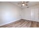 Bedroom features wood-look flooring, ceiling fan, and built in storage at 2412 53Rd S St, Gulfport, FL 33707