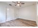 Bedroom features wood-look flooring, ceiling fan, built in storage, and bright window at 2412 53Rd S St, Gulfport, FL 33707
