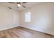 A well-lit bedroom features sleek wood floors, a ceiling fan, and a closet at 2412 53Rd S St, Gulfport, FL 33707