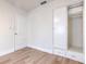 Bedroom featuring wood-look flooring, a closet with built-in drawers, and white paint at 2412 53Rd S St, Gulfport, FL 33707