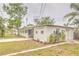 Rear view of home with driveway and landscaping at 2412 53Rd S St, Gulfport, FL 33707