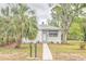 Charming home featuring a symmetrical design and well-maintained front yard at 2412 53Rd S St, Gulfport, FL 33707