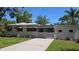 Charming single-story home with a white picket fence and well-manicured landscaping at 2412 53Rd S St, Gulfport, FL 33707