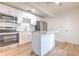 Bright kitchen features stainless steel appliances, white cabinets, and a center island at 2412 53Rd S St, Gulfport, FL 33707